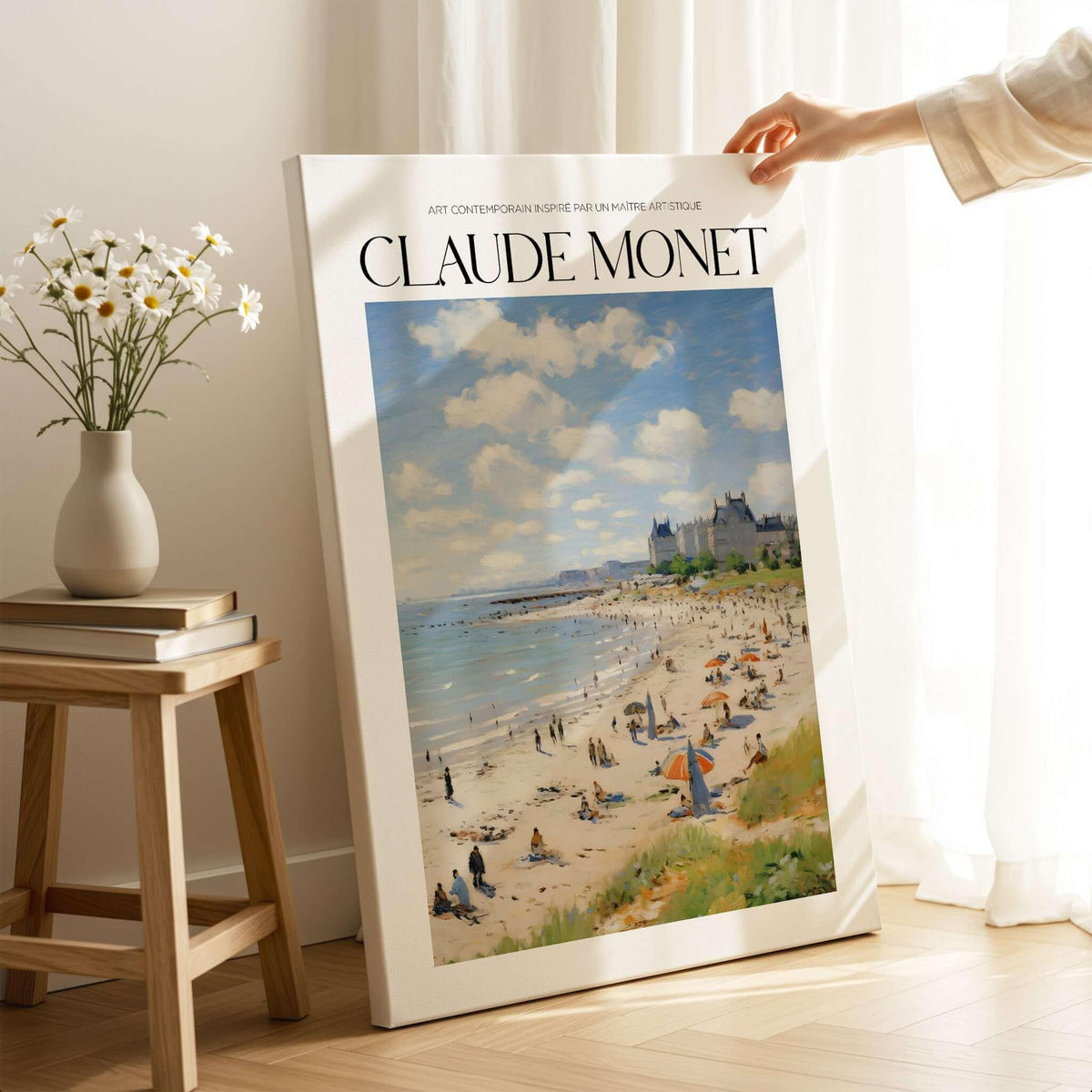 Claude Monet Sunny Beach Day Wall Art - Coastal Resort Scene Print displayed in a cozy home setting with flowers.