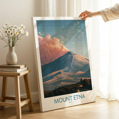 Hand holding Mount Etna travel poster canvas print in modern home interior with natural light
