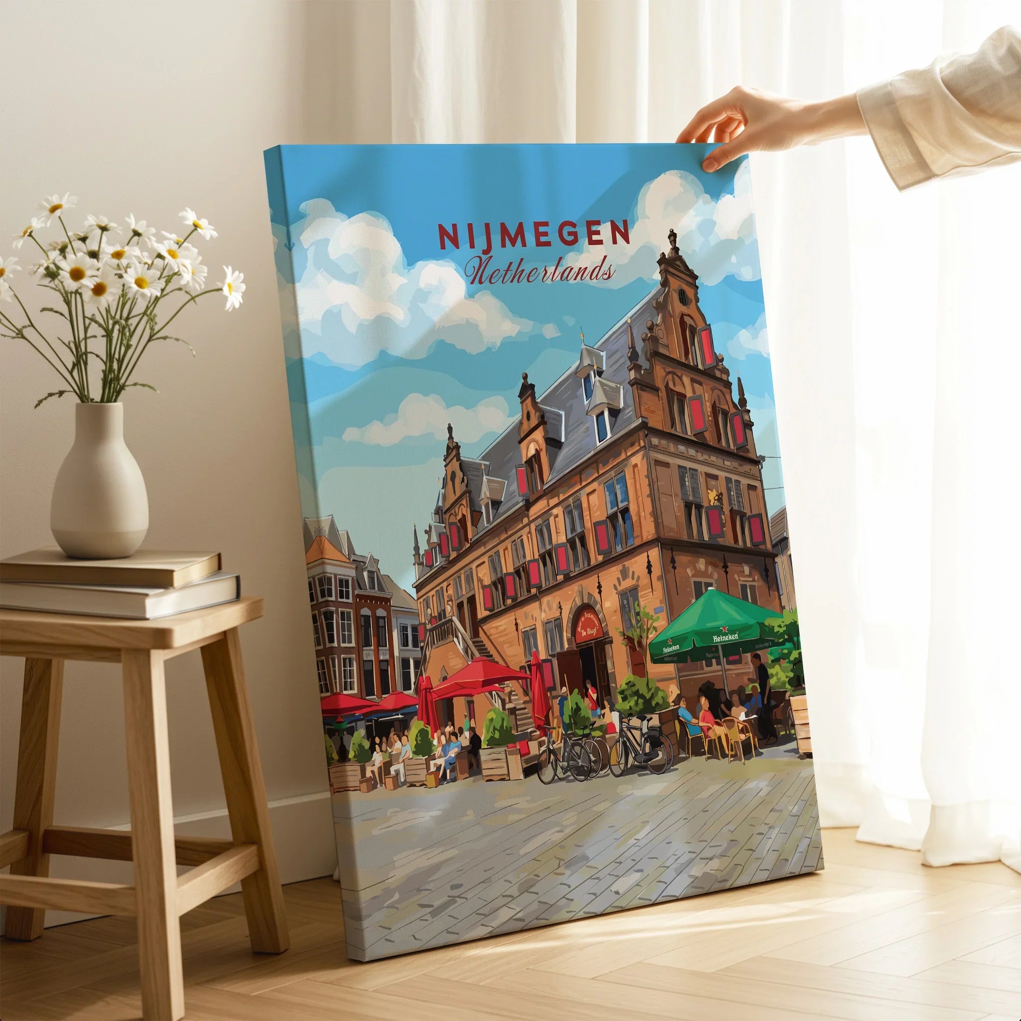 Hand holding Nijmegen Netherlands cityscape wall art print in modern home decor setting.