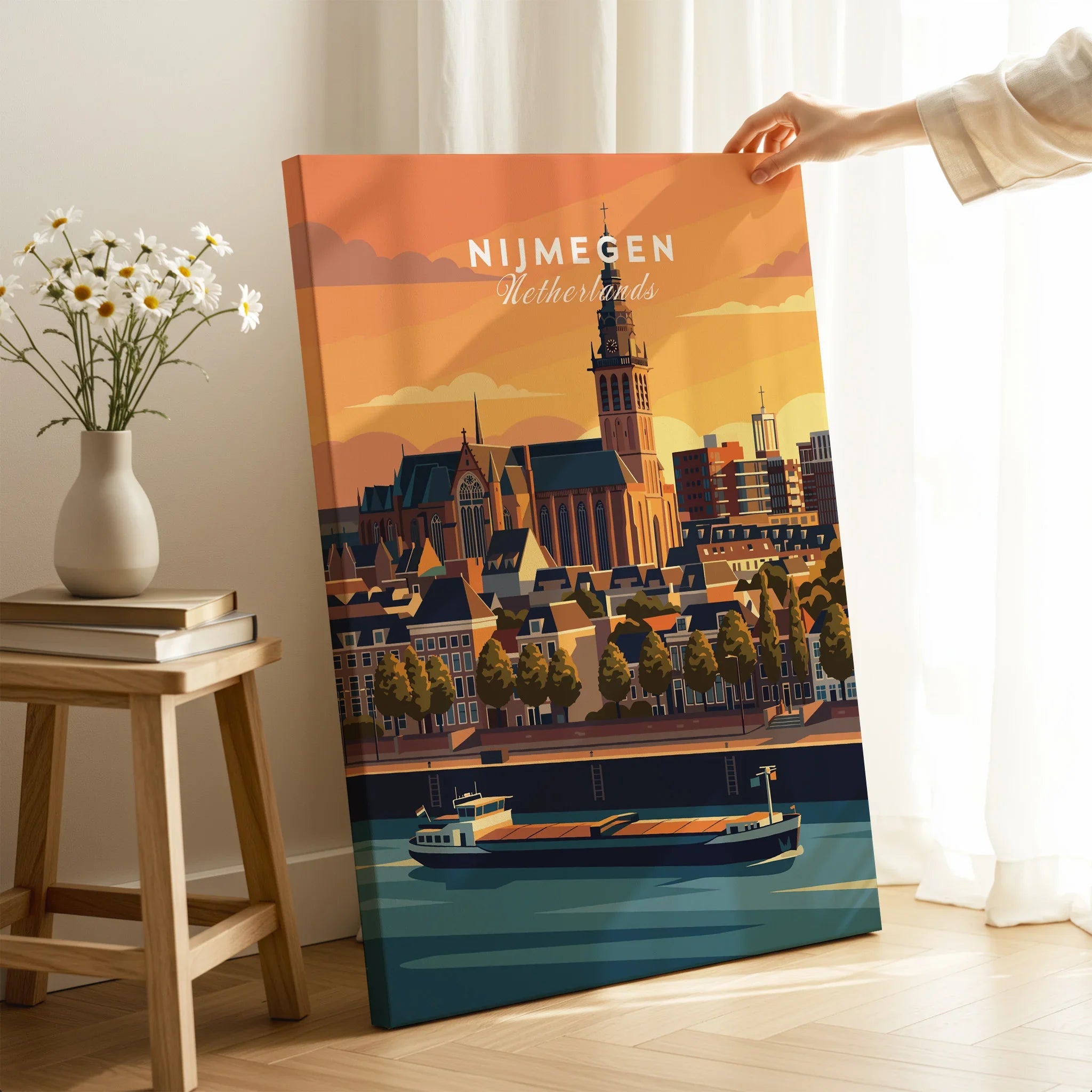 Hand holding Nijmegen Netherlands travel poster canvas print with city skyline and river in a modern living room setting