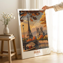 Paris France Autumn Seine River Art Print | Eiffel Tower and Notre Dame Poster displayed on an easel with autumn scenery.