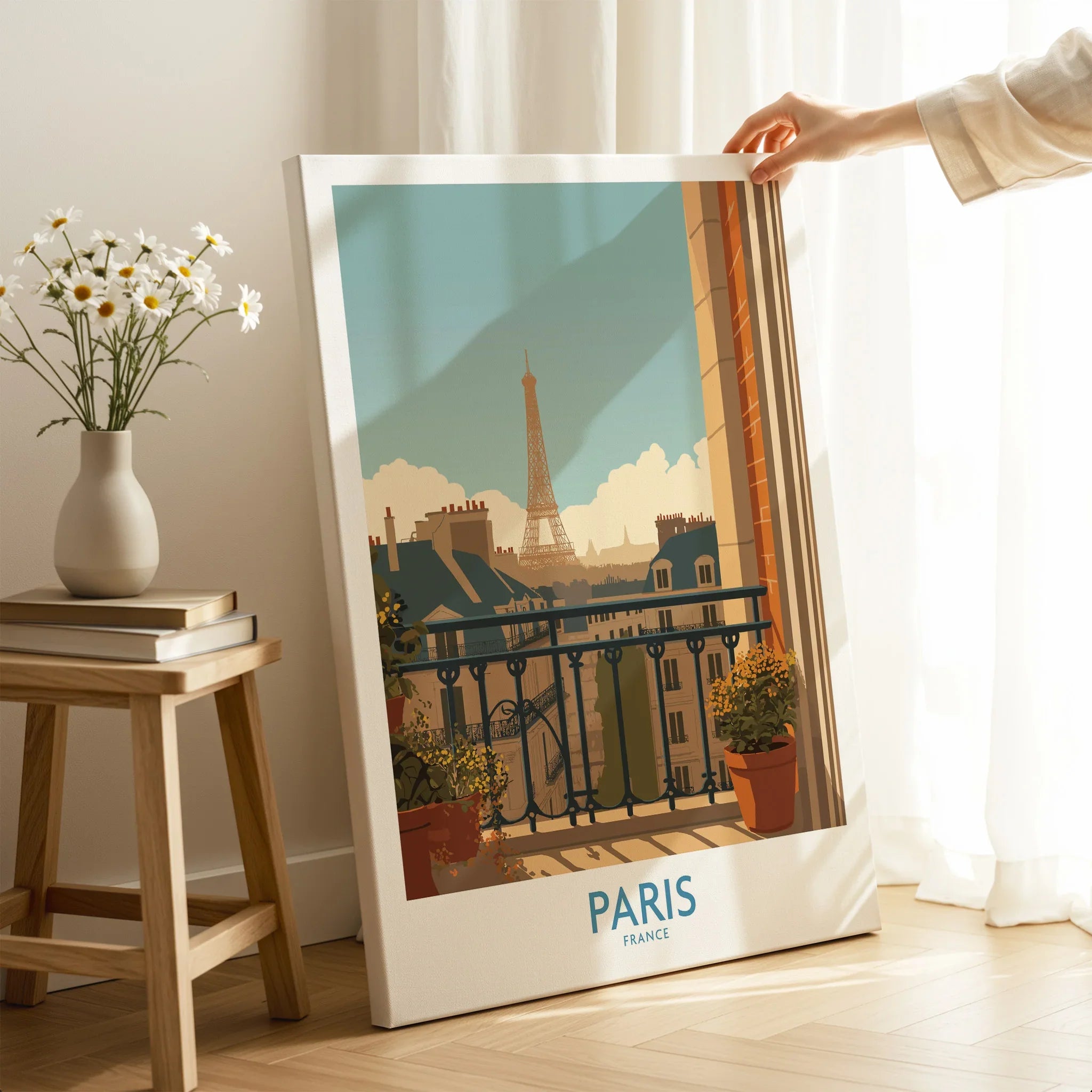 Paris travel poster canvas print with Eiffel Tower illustration, hand holding artwork in modern room