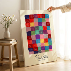 Paul Klee L univers De Klee Colorful Squares Abstract Grid Poster Art Print displayed on a stand with colorful squares.