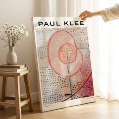 Paul Klee Blossoming Abstract Floral Modern Poster Art Print Decor displayed in a room with flowers and wooden furniture.