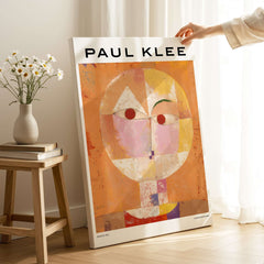 Paul Klee Senecio Head of Man Abstract Portrait Poster Art Print displayed near flowers and furniture.