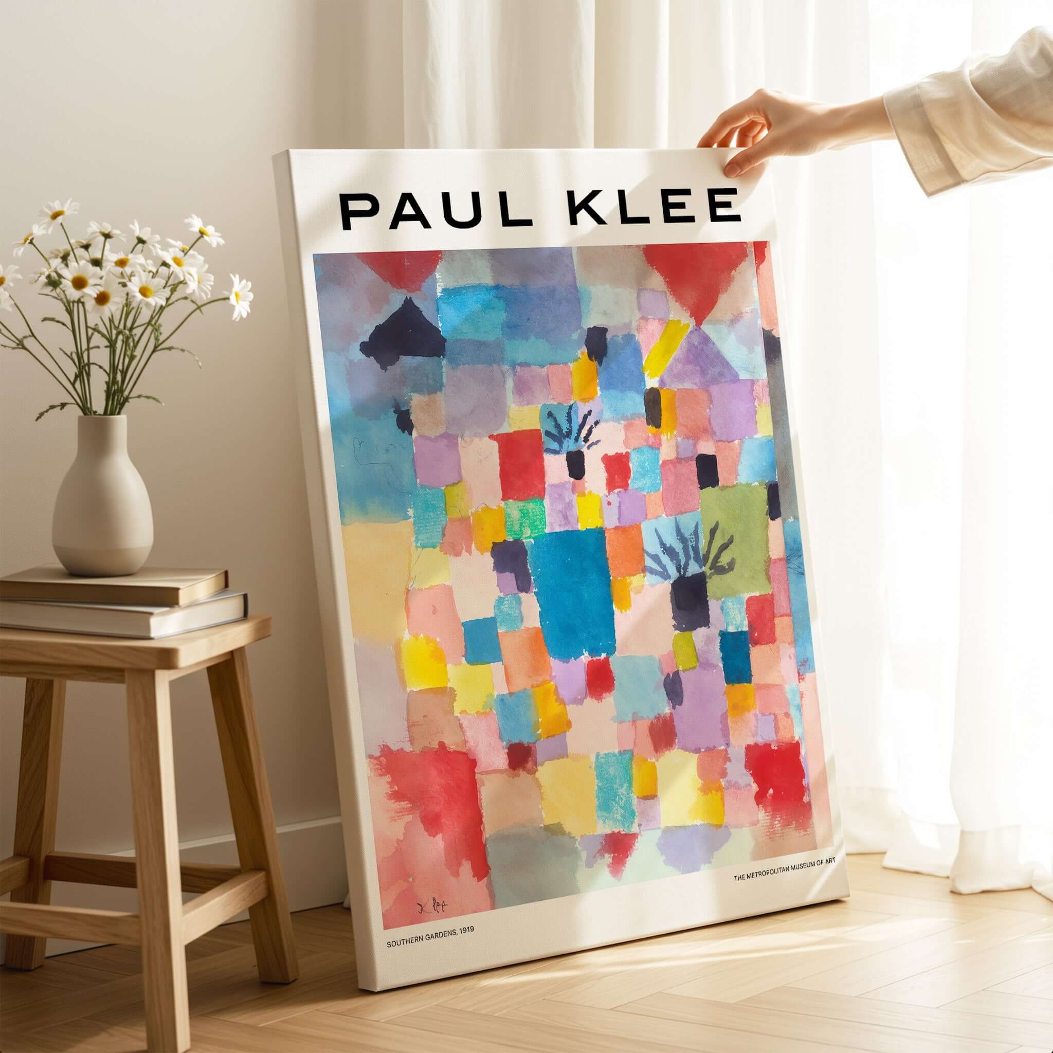 Paul Klee Southern Gardens Abstract Landscape Colorful Poster Art Print displayed on a wooden floor with flowers nearby.