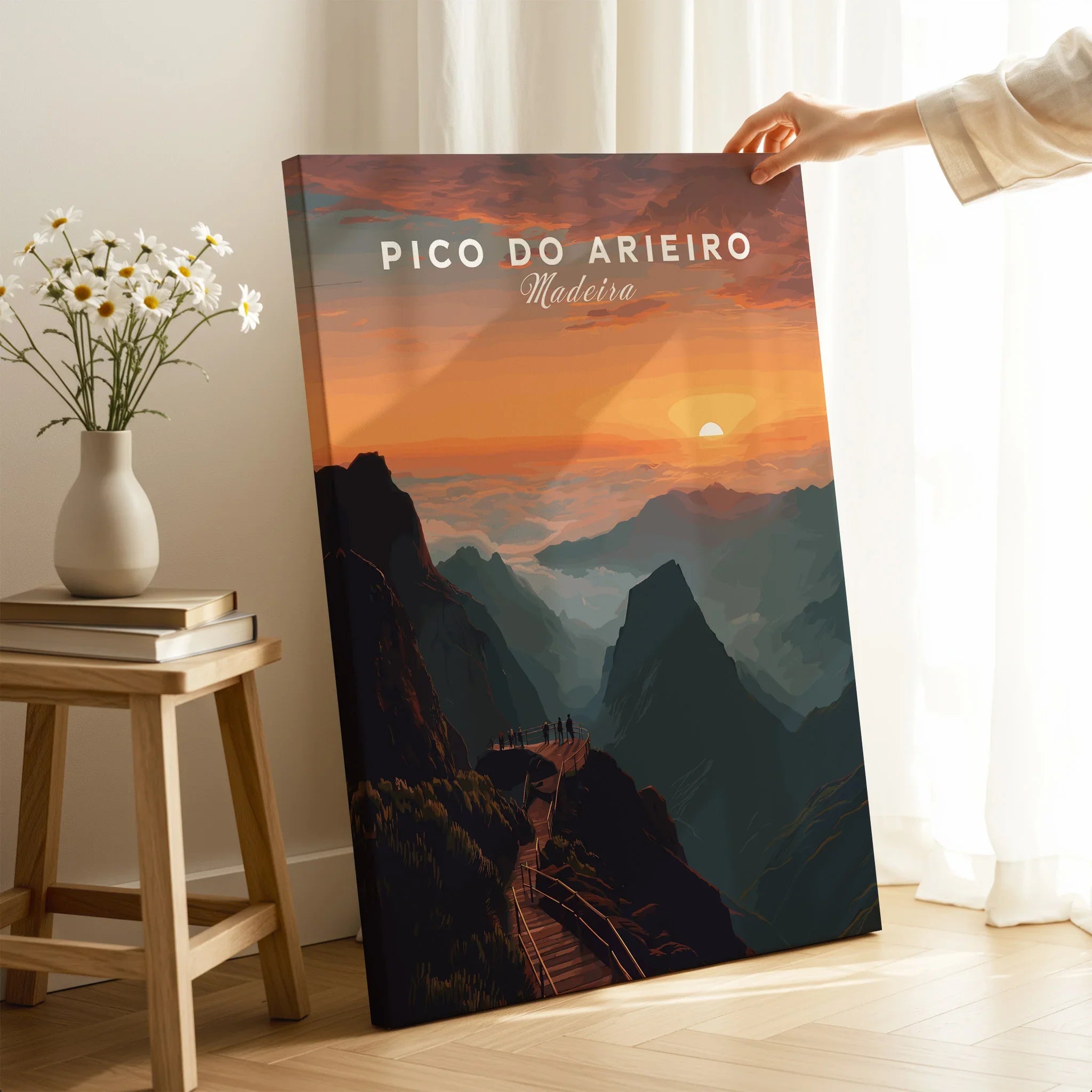 Hand holding Pico do Arieiro Madeira travel poster print with mountain sunset in modern room
