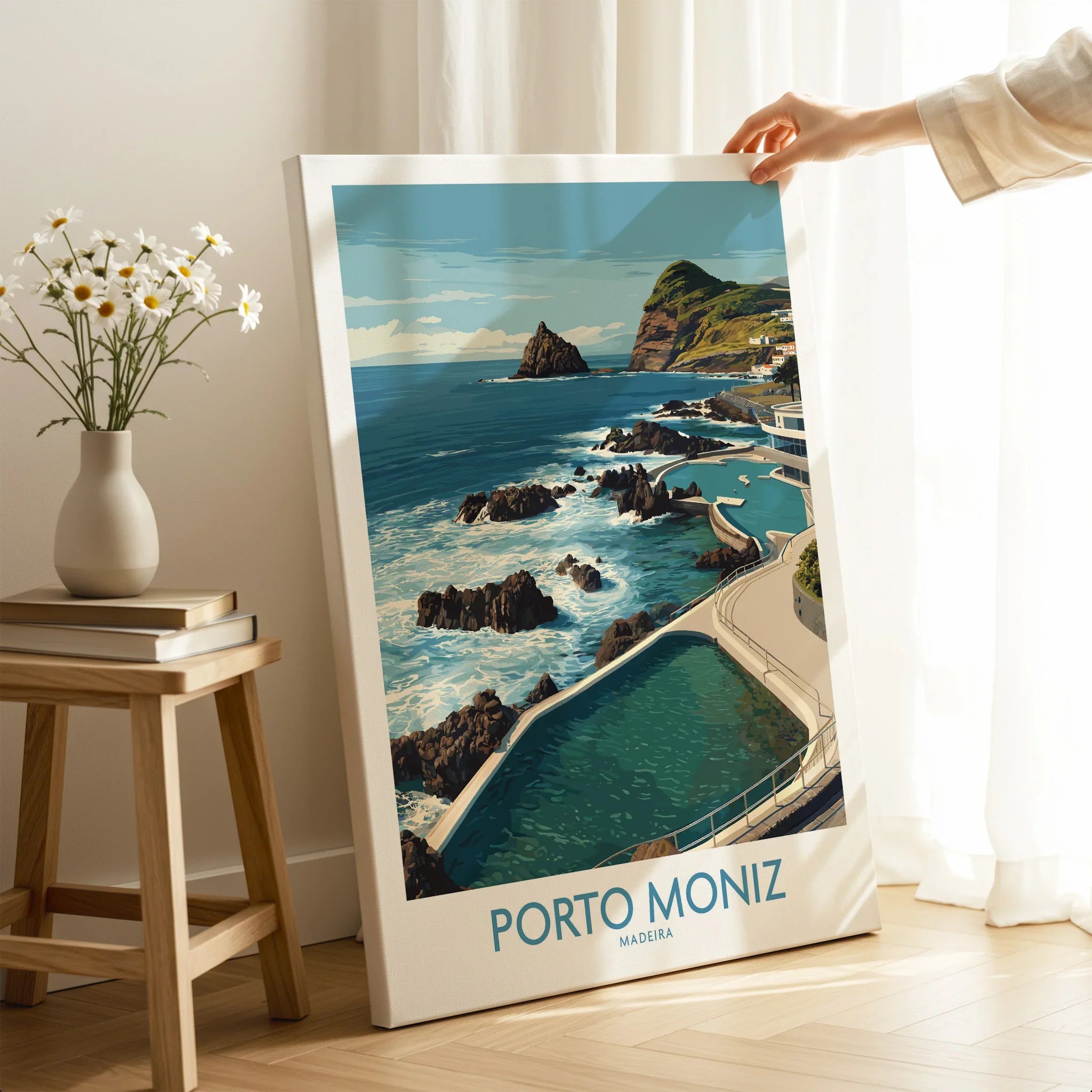 Hand holding Porto Moniz Madeira travel poster canvas print in modern room setting