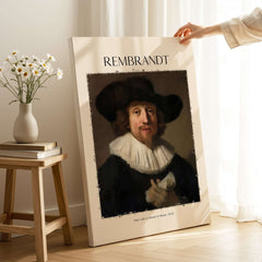 Rembrandt Man with Sheet Music 1633 Portrait Art Print Dutch Master Poster displayed in a cozy setting with flowers.