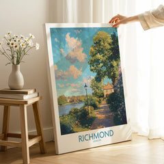Person holding Richmond London wall art print with scenic riverside landscape in bright room