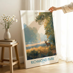 Richmond Park canvas art print with deer, propped in bright modern room next to vase and books