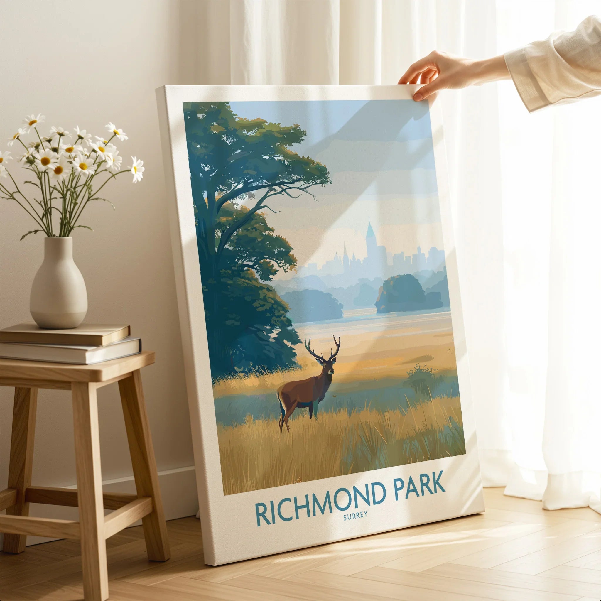 Richmond Park wall art canvas with deer in landscape, held in cozy modern room