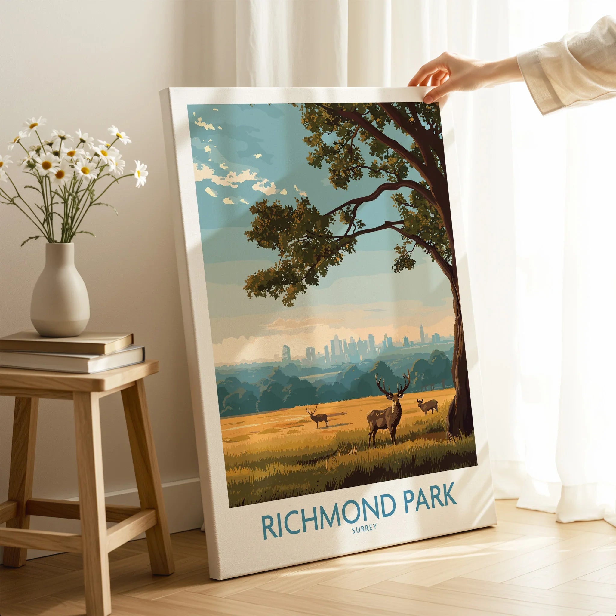 Hand holding Richmond Park canvas wall art print with deer and city skyline, home decor