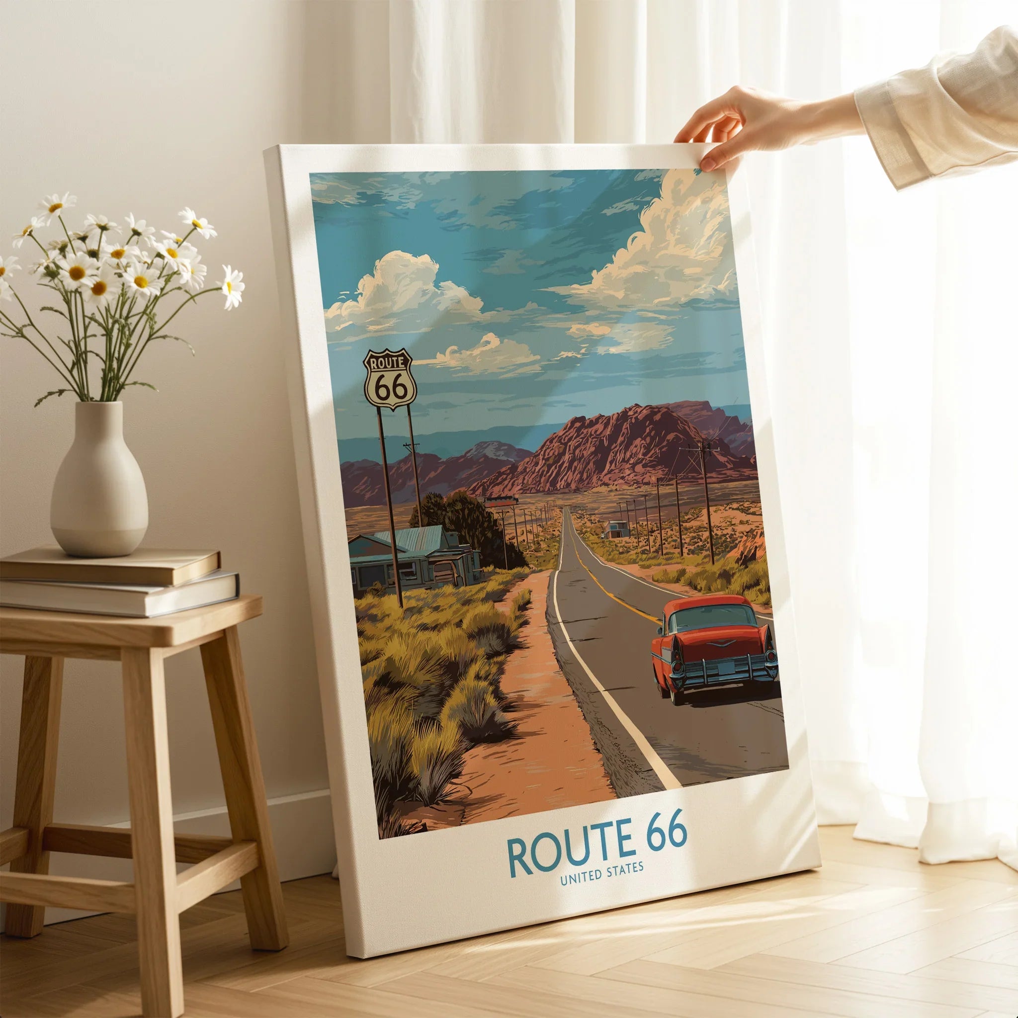 Route 66 travel poster canvas print with vintage car and desert landscape, held in modern room