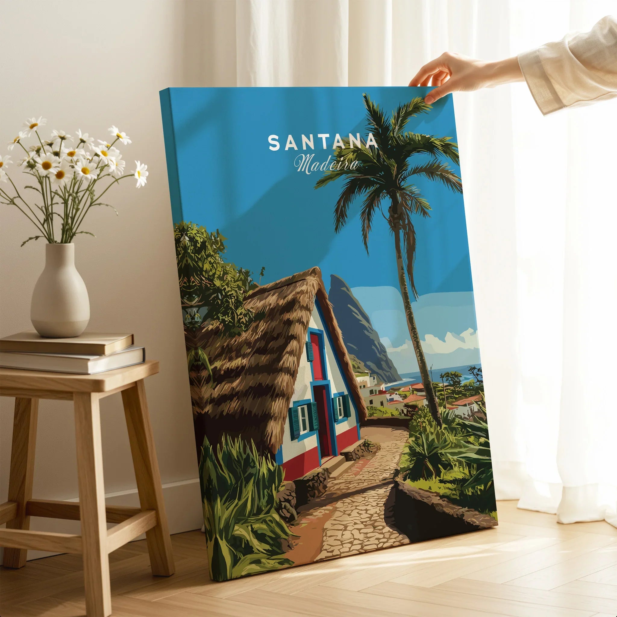 Santana Madeira travel poster canvas print with palm tree and cottage, hand holding artwork in bright modern room