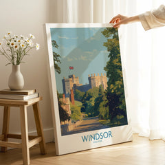 Hand holding Windsor England canvas art print in sunlit room, travel poster decor
