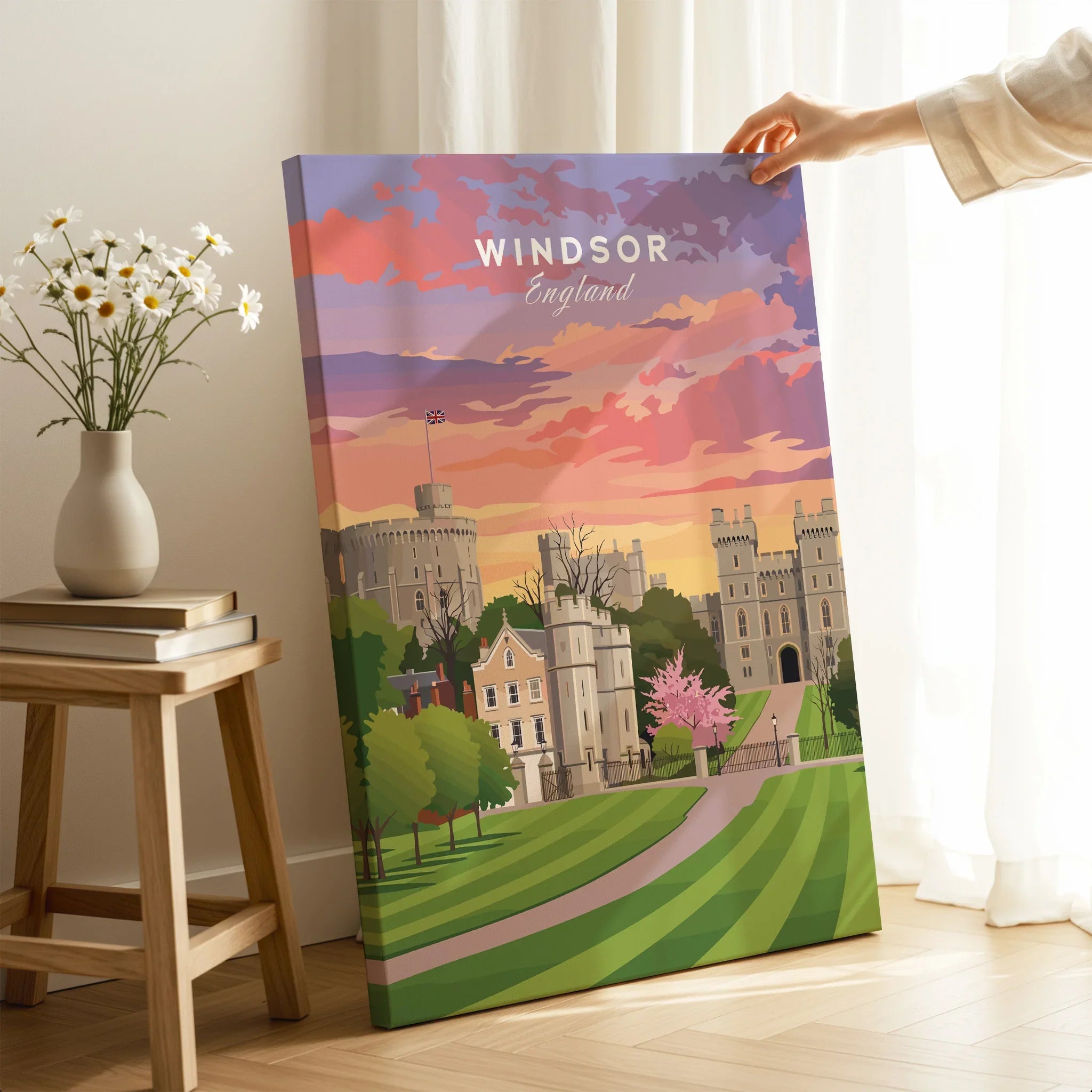 Hand holding Windsor England travel poster canvas print with castle and sunset design