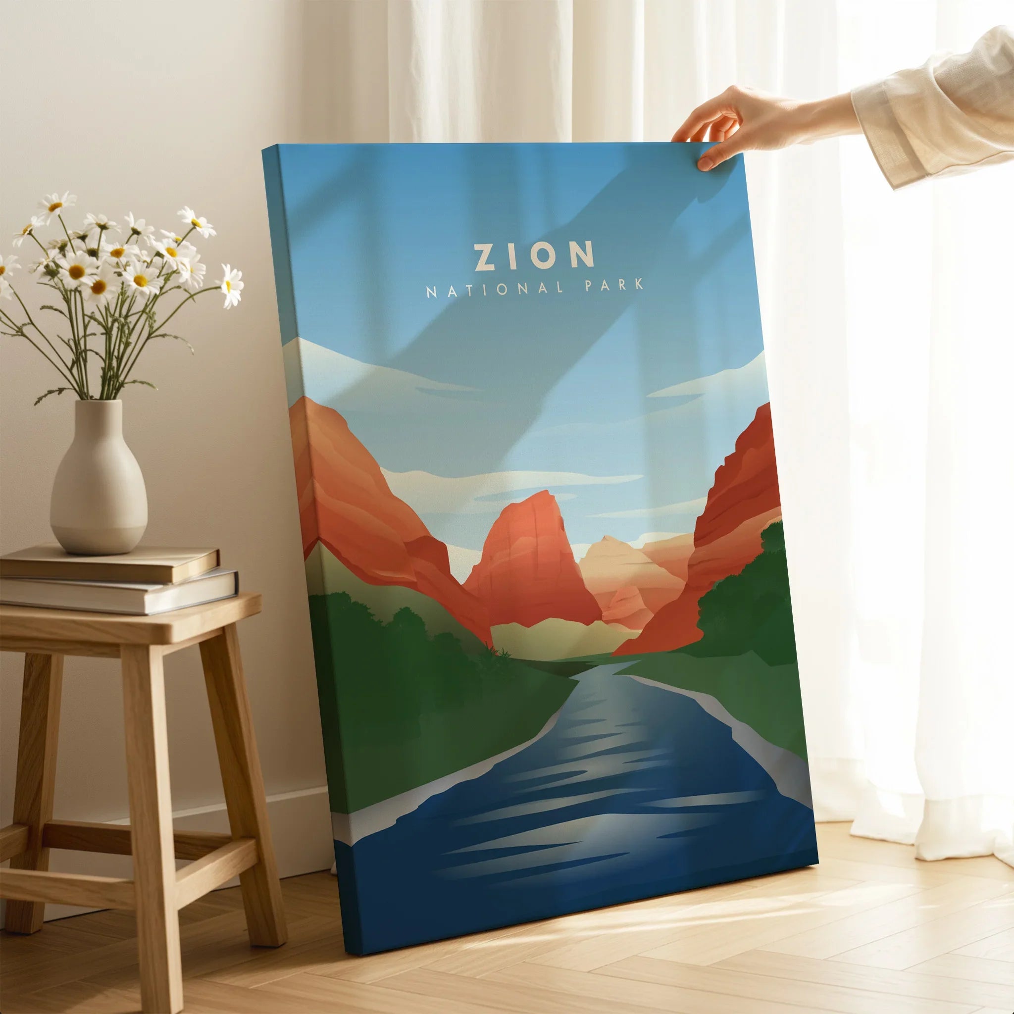 Zion National Park canvas print with red rock landscape, hand holding artwork in cozy room