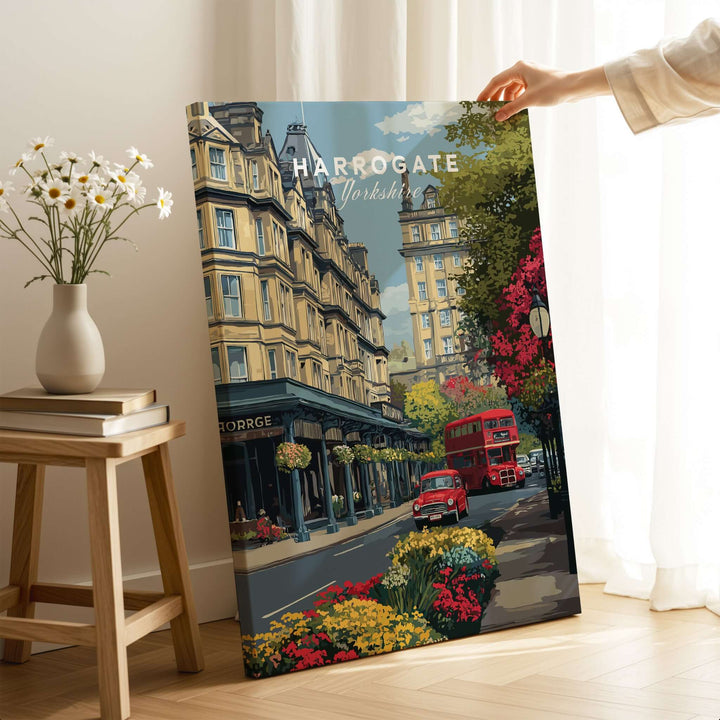 Harrogate Print | English City Wall Decor featuring vibrant urban scene with red bus and floral accents.