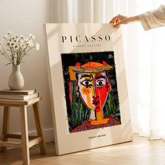 Picasso Woman in Hat Red Yellow Face Portrait Poster Colorful Abstract Artwork Print displayed in a modern interior setting.