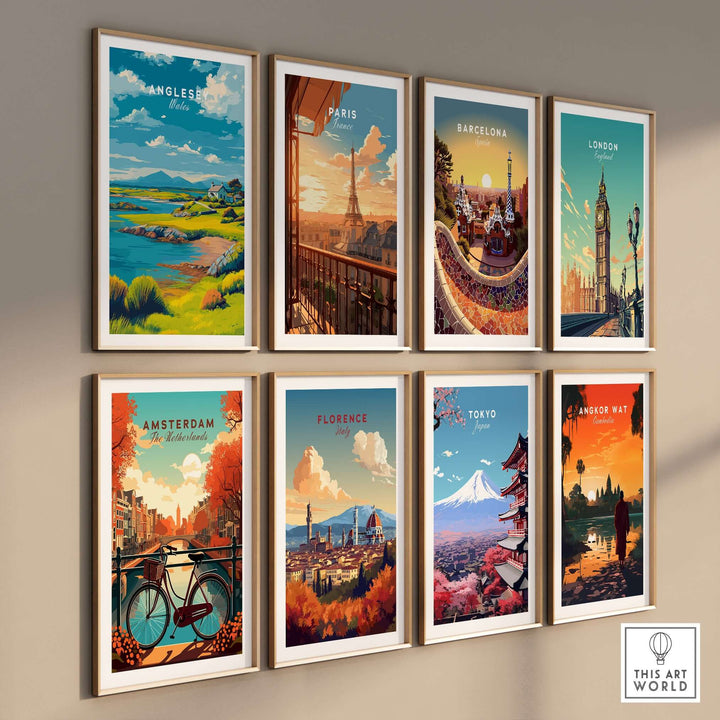 Gallery of vintage travel prints including Anglesey, Paris, Barcelona, London, and more, framed and displayed on a wall.