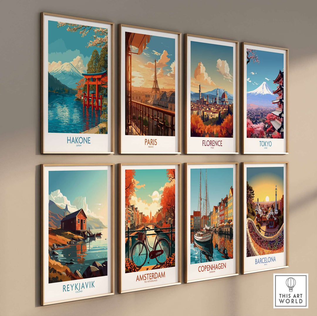 Gallery wall featuring vibrant travel posters of Hakone, Paris, Florence, Tokyo, Reykjavik, Amsterdam, Copenhagen, and Barcelona.