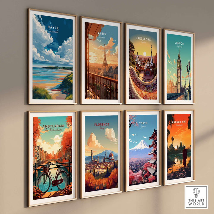 Gallery wall featuring travel posters of Hayle, Paris, Barcelona, London, Amsterdam, Florence, Tokyo, and Angkor Wat.