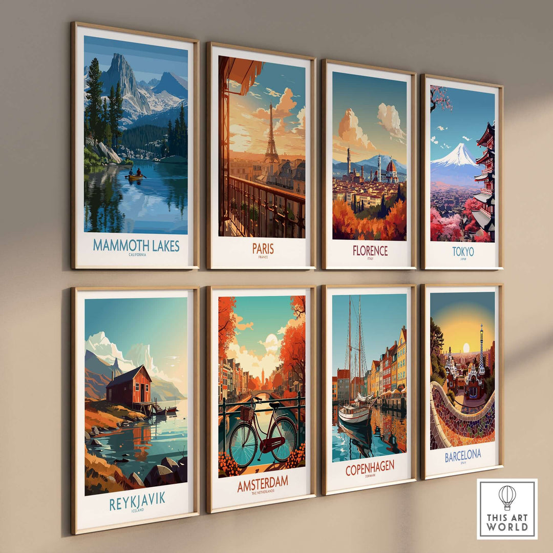 Collection of vibrant travel prints featuring Mammoth Lakes, Paris, Florence, Tokyo, and more, displayed on a wall.