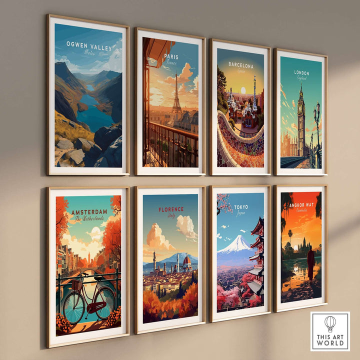 Artistic wall display featuring prints of Ogwen Valley, Paris, Barcelona, London, Amsterdam, Florence, Tokyo, and Angkor Wat.
