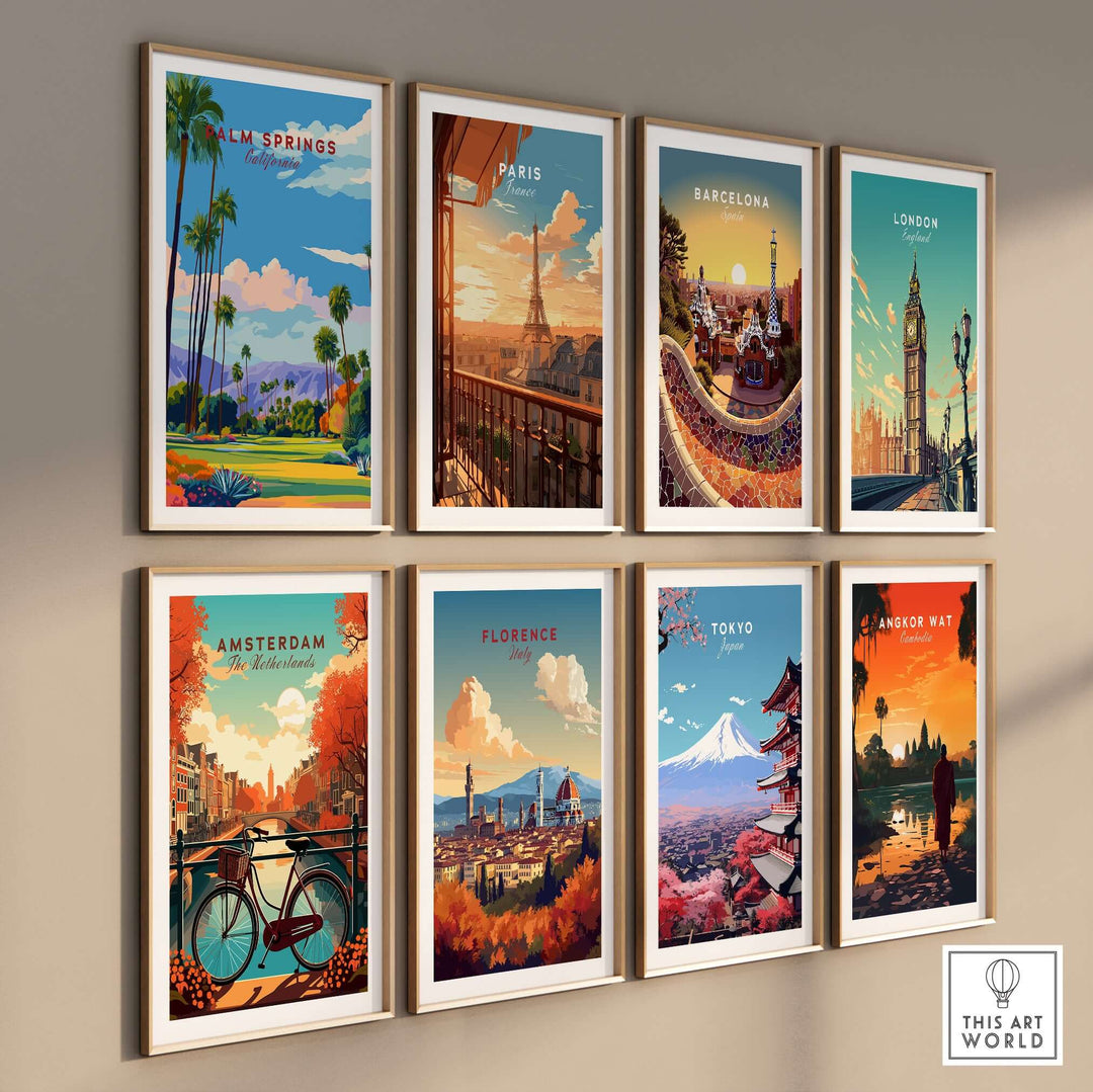 Colorful travel art prints on a wall featuring Palm Springs, Paris, Barcelona, London, Amsterdam, Florence, Tokyo, and Angkor Wat.