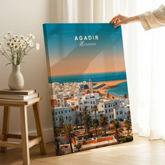 Agadir Travel Poster – City Skyline on stretched canvas with mirror-wrap edges, held by hand in a room setting