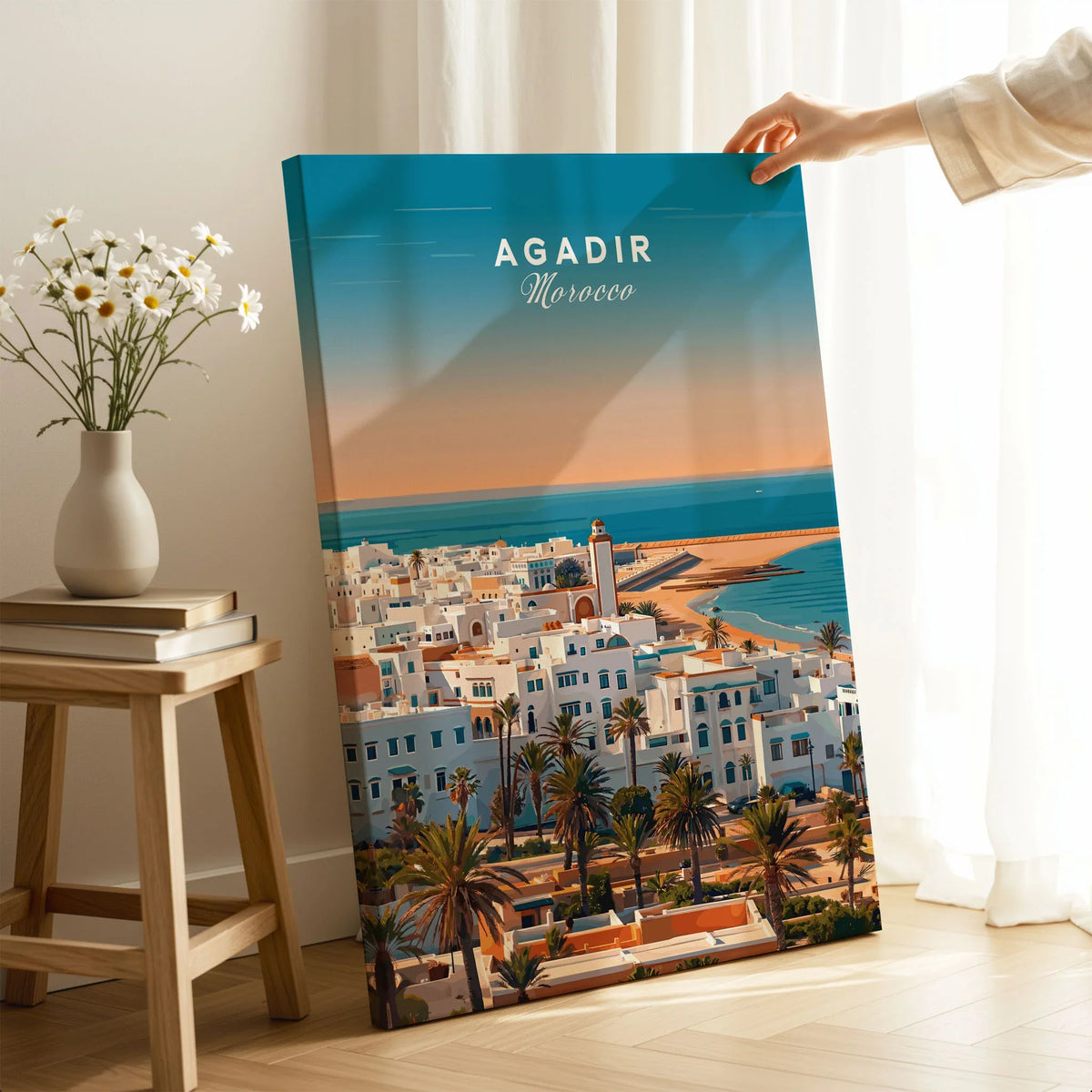 Agadir Travel Poster – City Skyline on stretched canvas with mirror-wrap edges, held by hand in a room setting