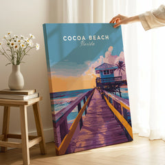 Cocoa Beach Boardwalk Print - Florida Sunset Wall Art on stretched canvas with mirror-wrap edges, held by hand in a room setting