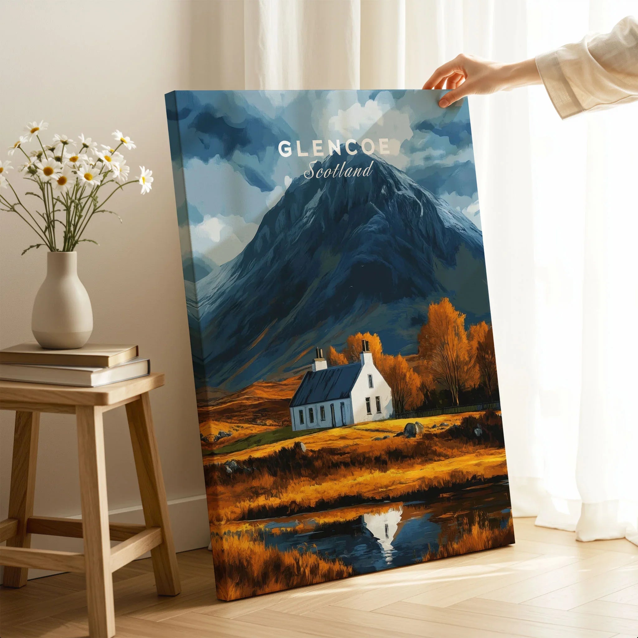 Glencoe Scotland Poster on stretched canvas with mirror-wrap edges, held by hand in a room setting