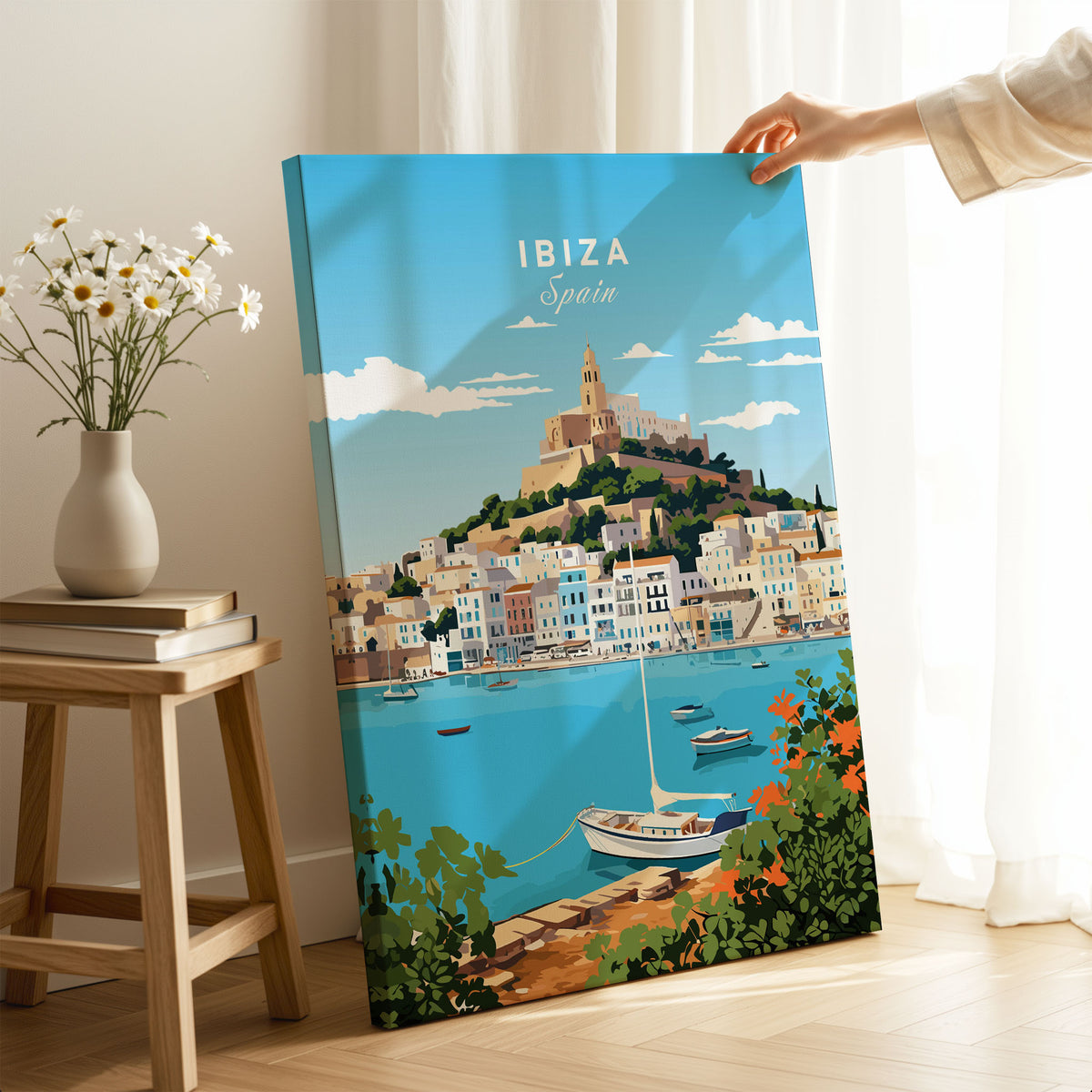 Ibiza Print on stretched canvas with mirror-wrap edges, held by hand in a room setting