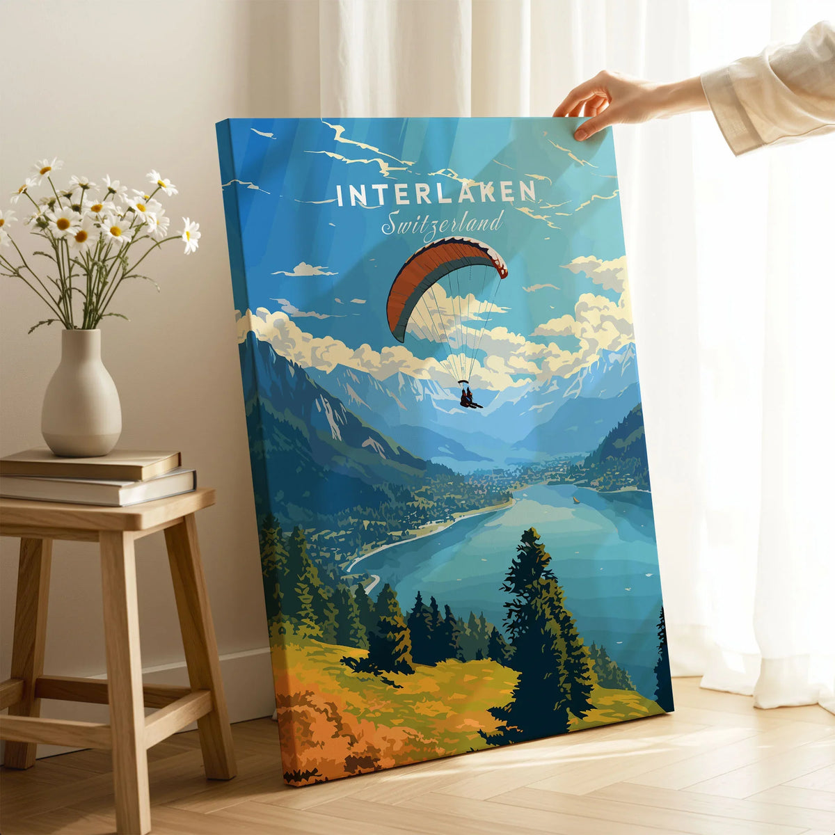Interlaken Switzerland Poster on stretched canvas with mirror-wrap edges, held by hand in a room setting