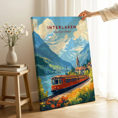 Interlaken Travel Print on stretched canvas with mirror-wrap edges, held by hand in a room setting