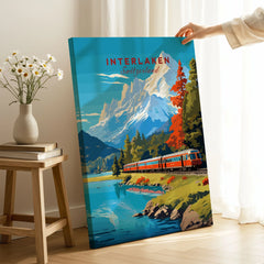Interlaken Print Switzerland on stretched canvas with mirror-wrap edges, held by hand in a room setting