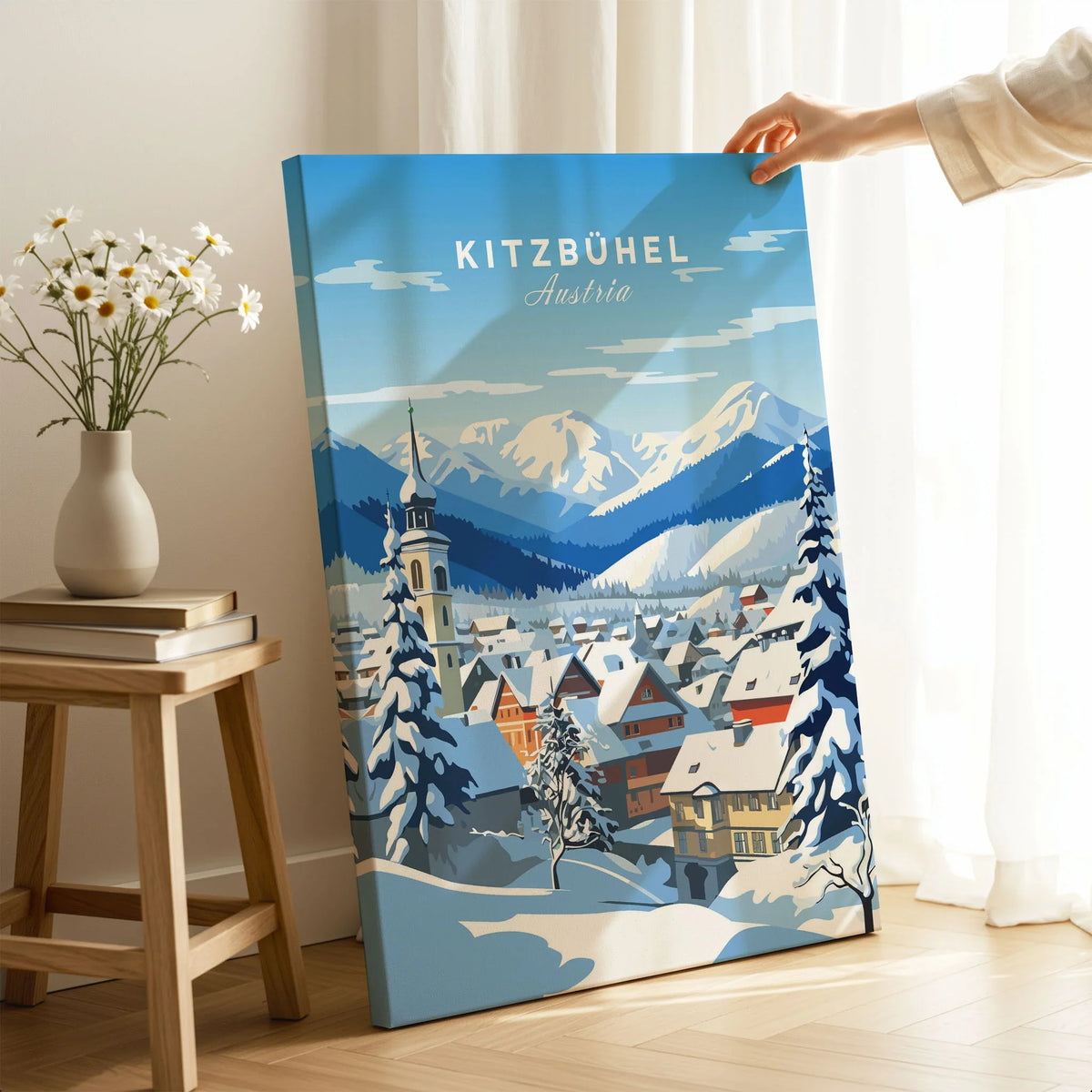 Kitzbuhel Poster on stretched canvas with mirror-wrap edges, held by hand in a room setting