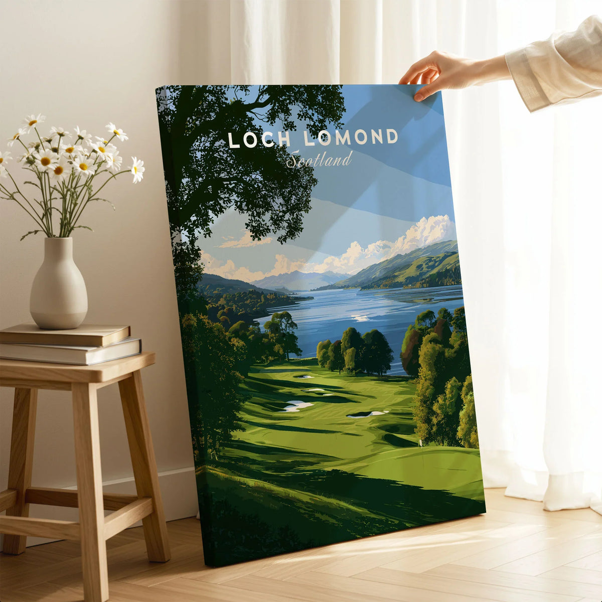 Loch Lomond Scotland Summer Shore Travel Poster — a sunlit grassy shoreline running down to Loch Lomond under old oaks, shown as canvas print mirror edge hand holding room setting