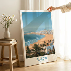 Agadir Morocco Print – Panoramic Beach and Palm Tree Wall Decor on stretched canvas with mirror-wrap edges, held by hand in a room setting