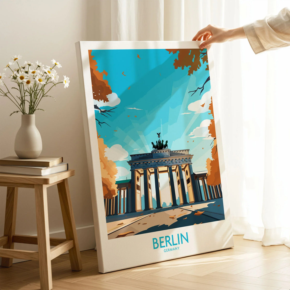 Berlin Wall Art Modern on stretched canvas with mirror-wrap edges, held by hand in a room setting