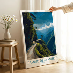 Camino de la Muerte Bolivia Cliff Road Wall Art — the Yungas cliff road curving along a jungle mountainside above the Bolivian Andes, shown as canvas print mirror edge hand holding room setting