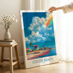 Cocoa Beach Rainbow Cloud Poster - Florida Travel Decor on stretched canvas with mirror-wrap edges, held by hand in a room setting