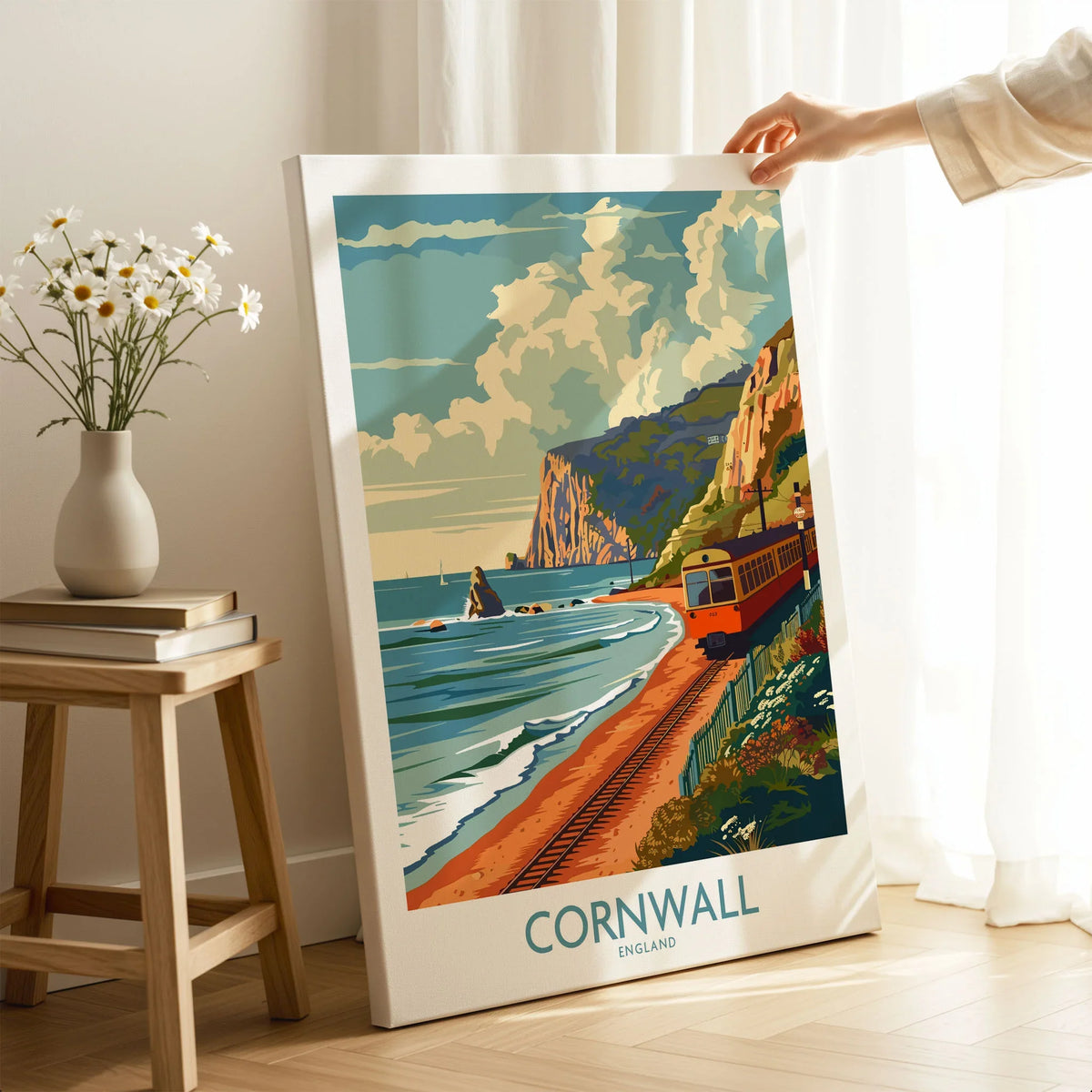 Cornwall Coast Wall Art Print on stretched canvas with mirror-wrap edges, held by hand in a room setting