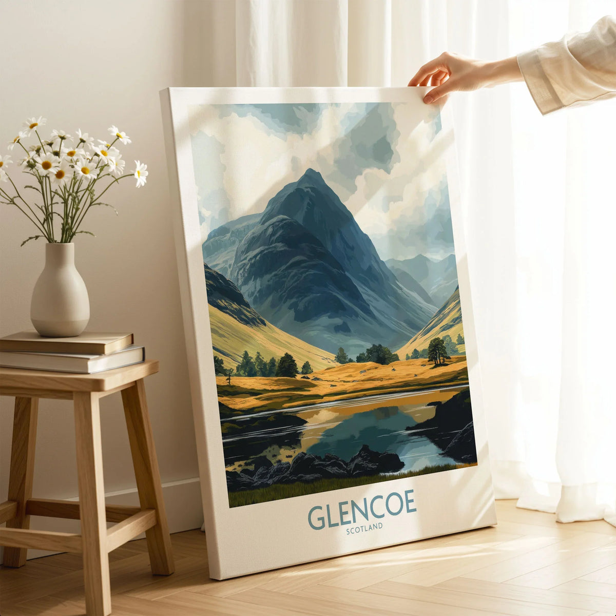 Glencoe Travel Poster on stretched canvas with mirror-wrap edges, held by hand in a room setting