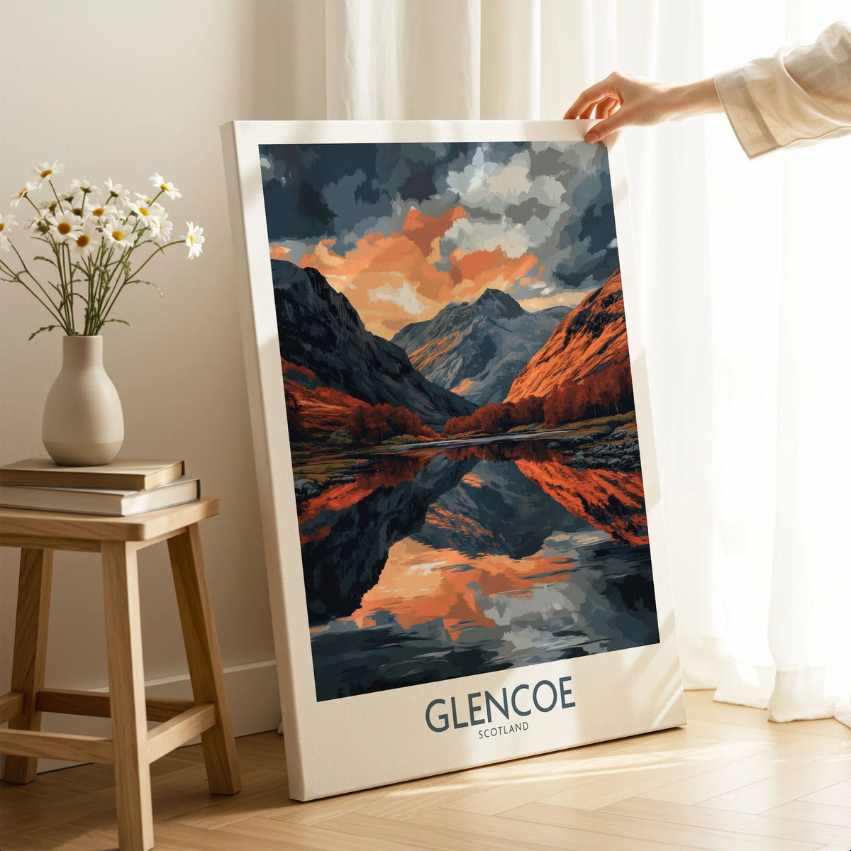 Glencoe Wall Art Poster on stretched canvas with mirror-wrap edges, held by hand in a room setting
