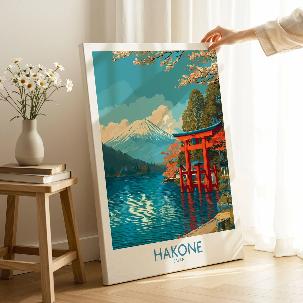 Hakone Wall Art Japan Red Torii Gate Poster on stretched canvas with mirror-wrap edges, held by hand in a room setting
