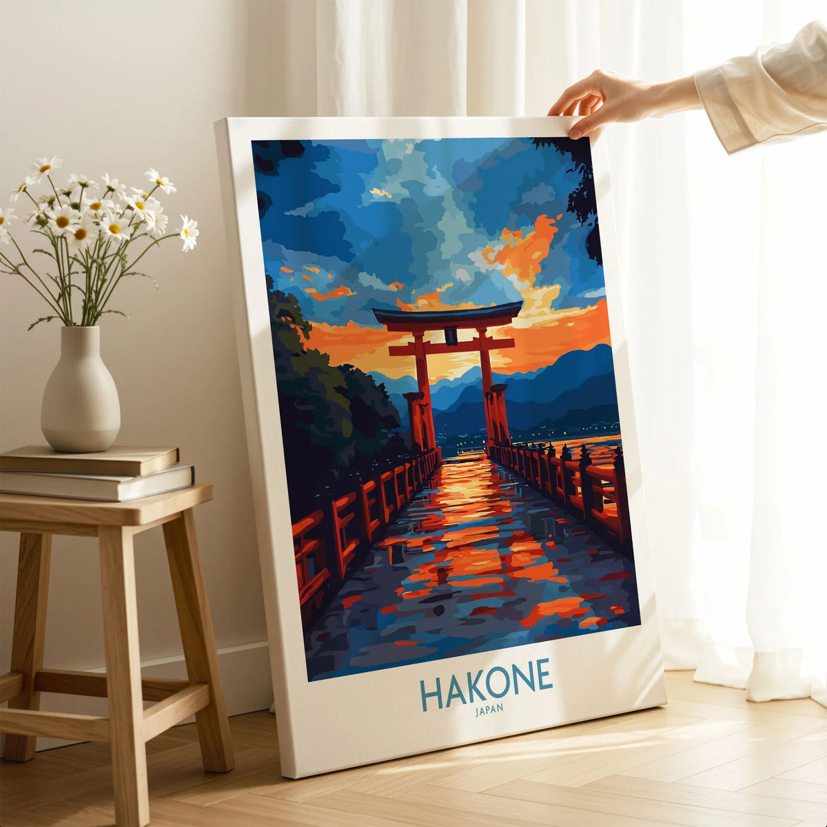 Hakone Wall Art - Japan Travel Poster on stretched canvas with mirror-wrap edges, held by hand in a room setting