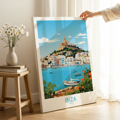 Ibiza Poster on stretched canvas with mirror-wrap edges, held by hand in a room setting